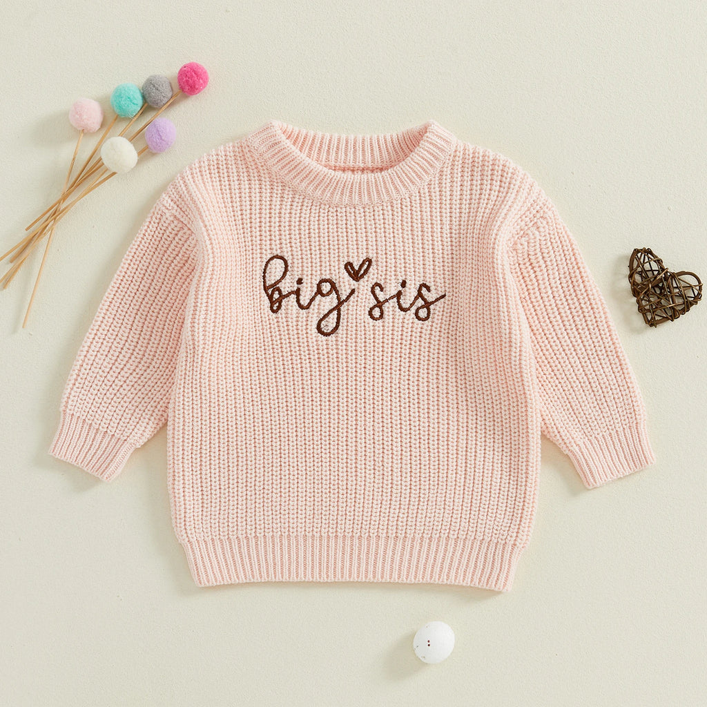Close-up of 'Big Sister' embroidery on pink knit jumper – Little Eedie baby clothes