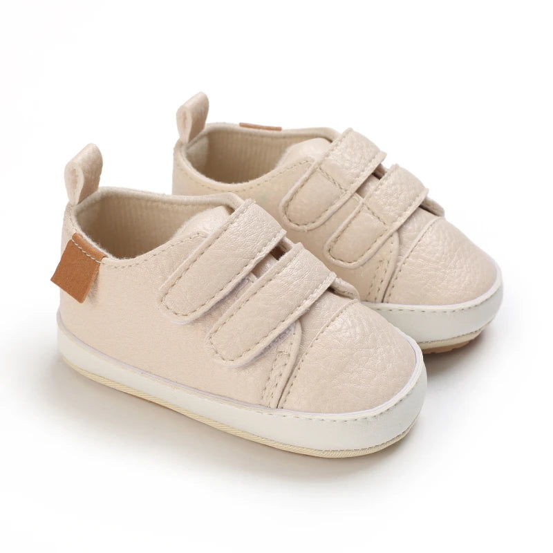 Cream baby shoes with soft soles