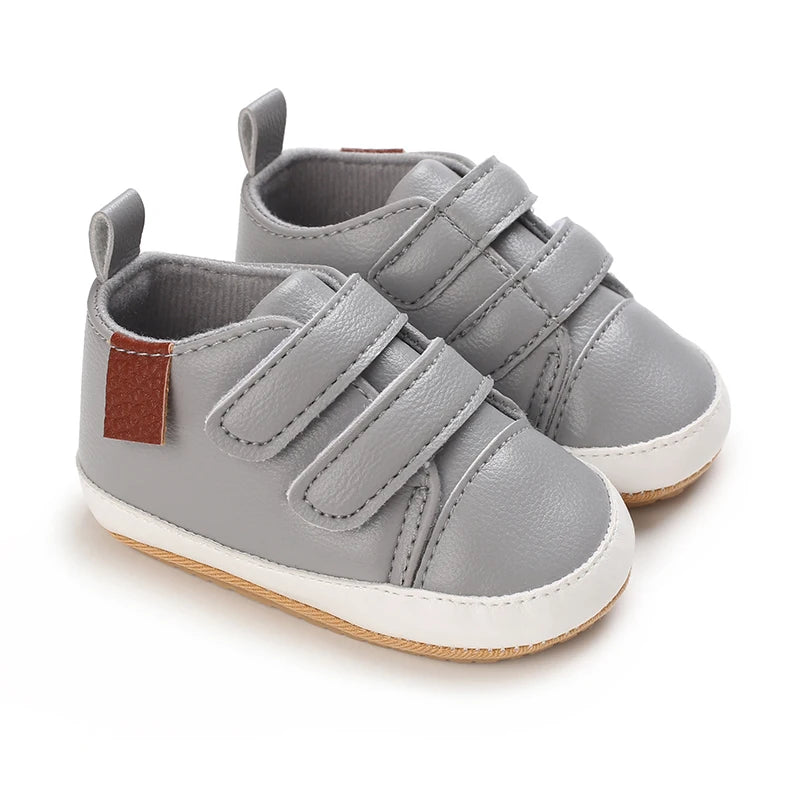 Grey baby shoes with soft soles