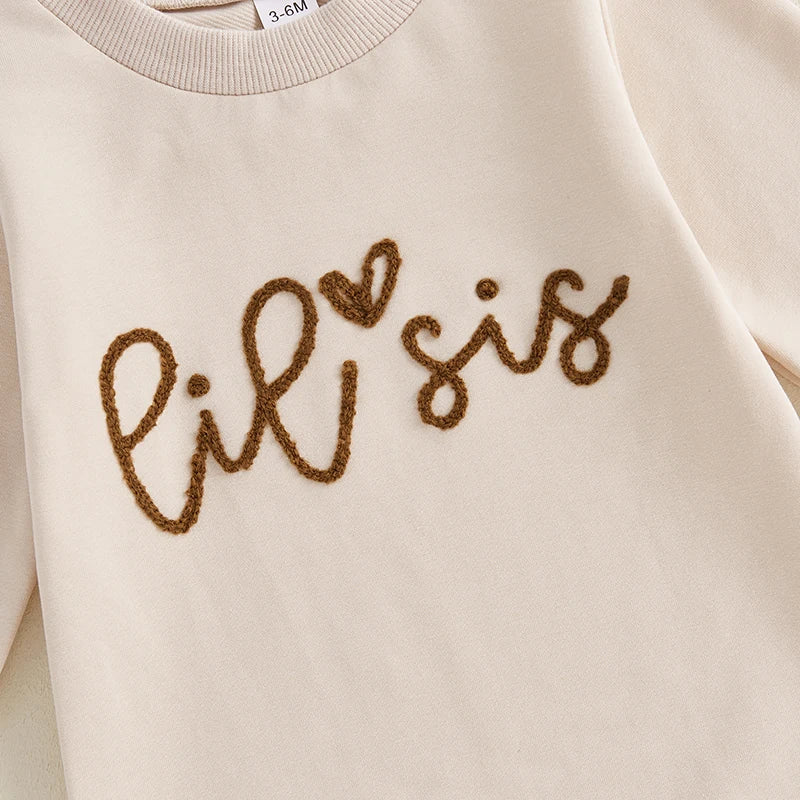 Close up of lil sis romper in cream 
