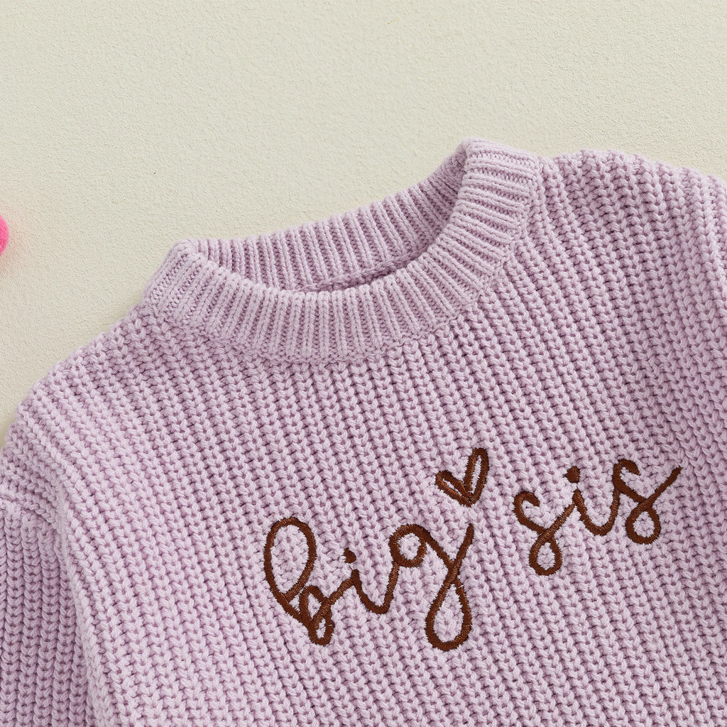 Side view of baby in purple Big Sister jumper – stylish toddler outfit