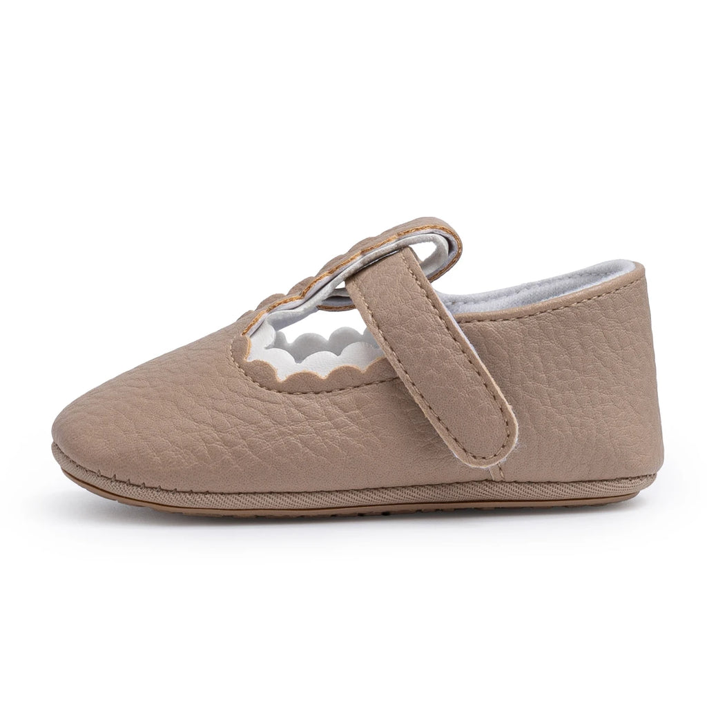 Side view of beige early walker baby shoes