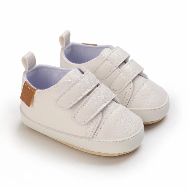 White baby shoes with soft soles