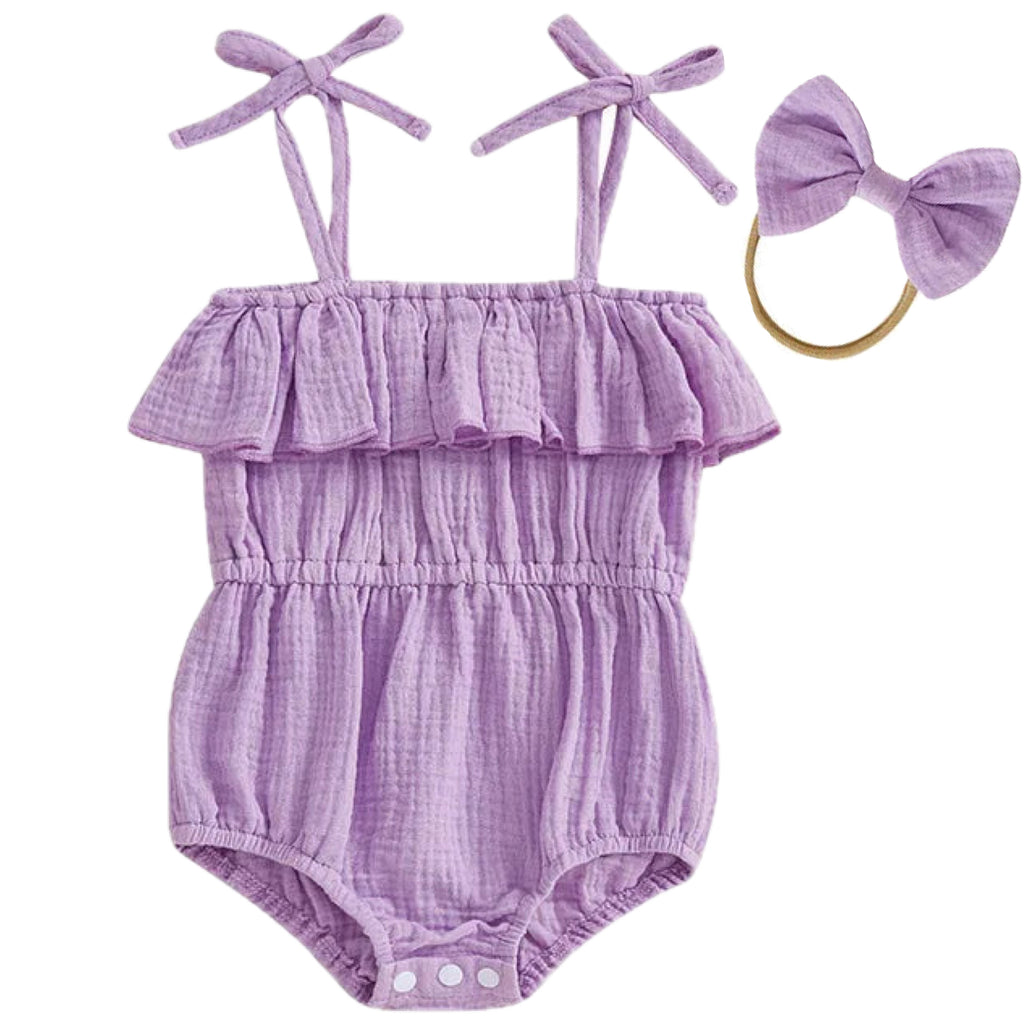 Baby girl purple ruffle romper flat lay