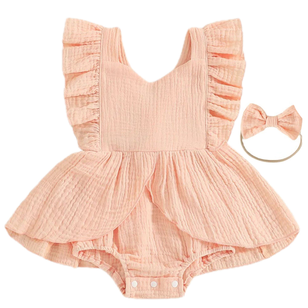 Pink baby romper with ruffled details and matching headband on a white background