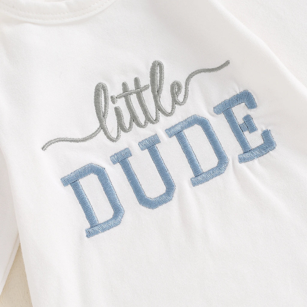 Flat lay of baby boy clothing set with white romper, blue leggings and beanie – Little Eedie babywear Australia