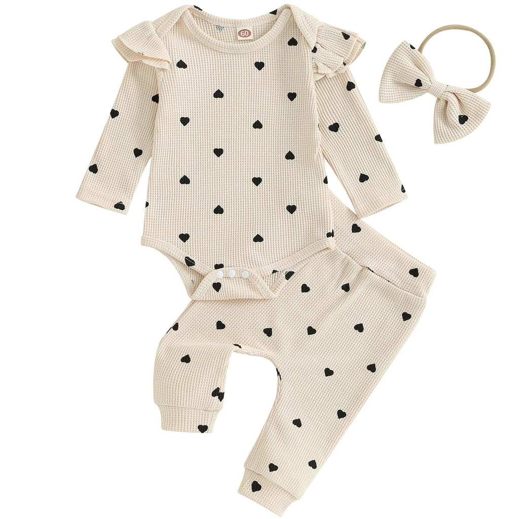 Cream baby outfit with flutter sleeves and bow