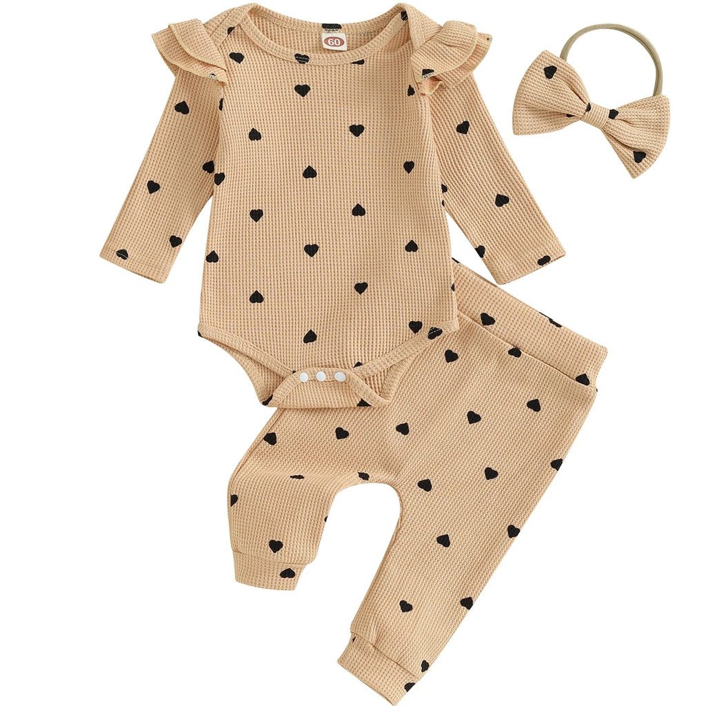 Cream baby outfit with flutter sleeves and bow