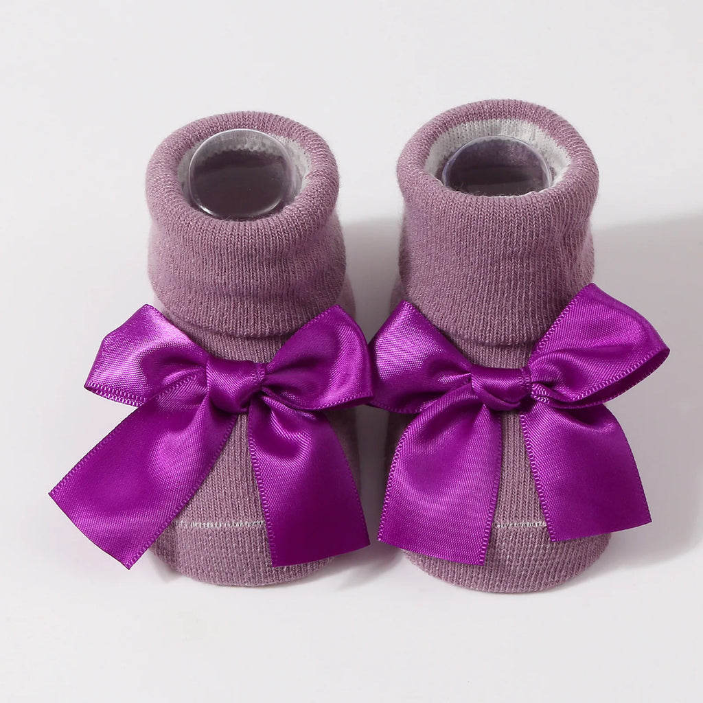 Purple newborn baby socks with satin bow