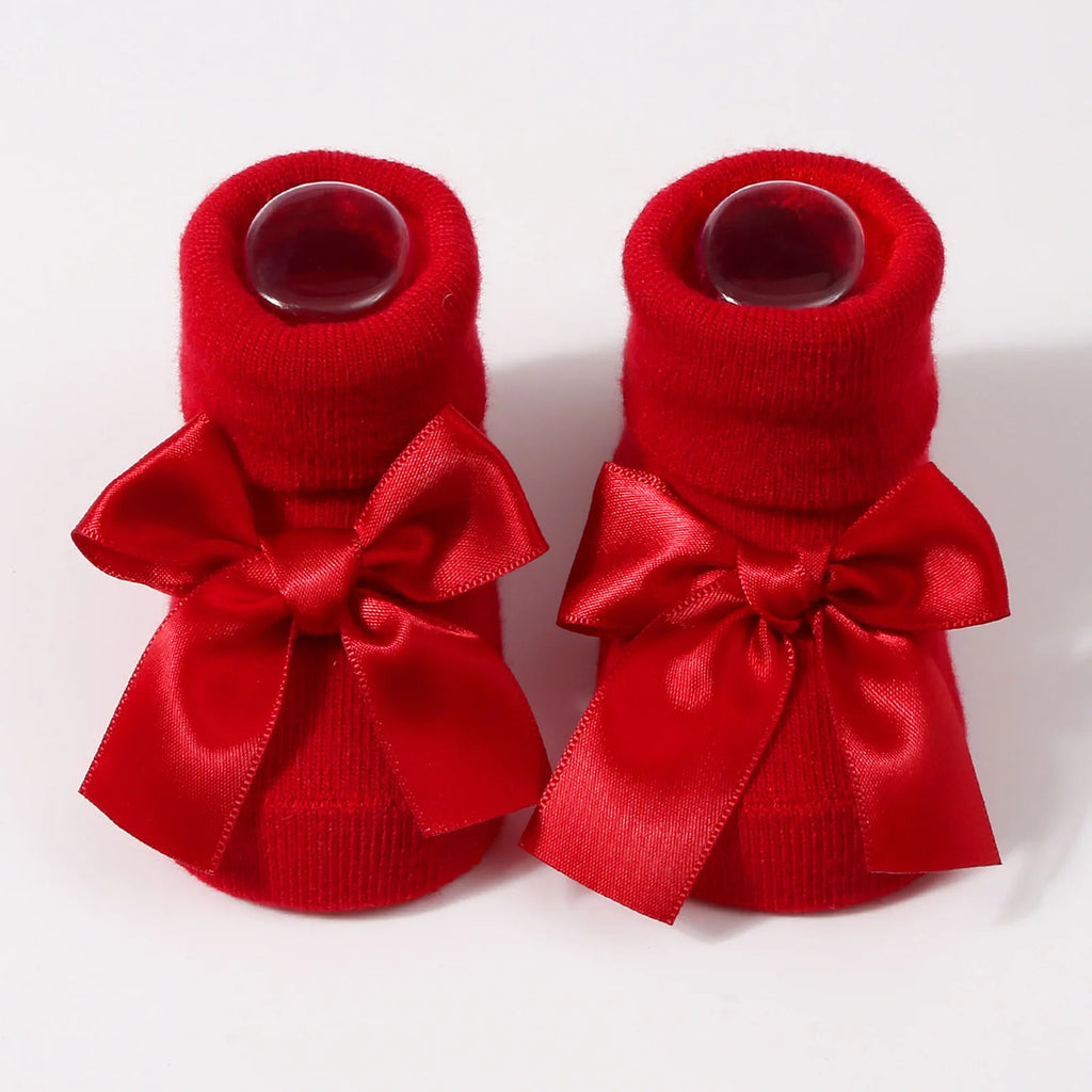 Red satin bow baby socks for Christmas