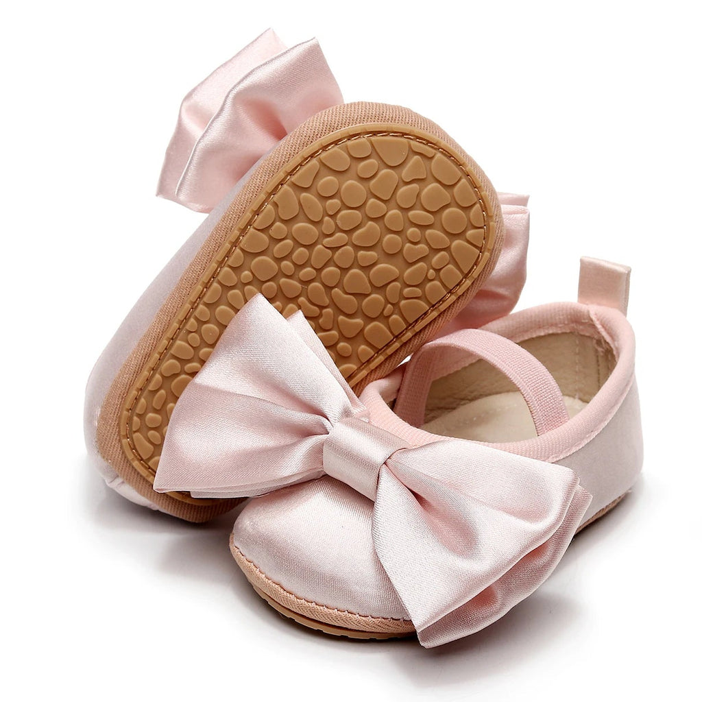 Mia Pink Baby Girl Shoes with satin bow on white background