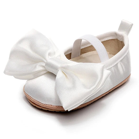 White satin-look baby shoes with elastic strap