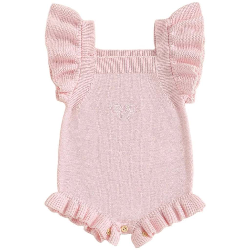 Pink baby knit romper with ruffled details on a white background