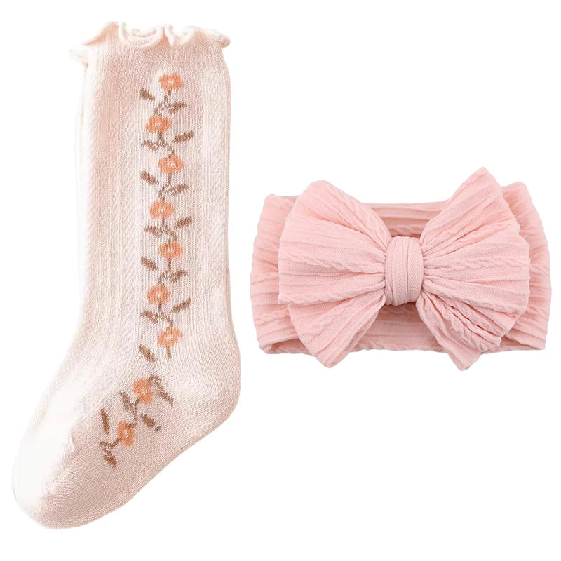 Pink baby girl gift set with floral socks and bow headband