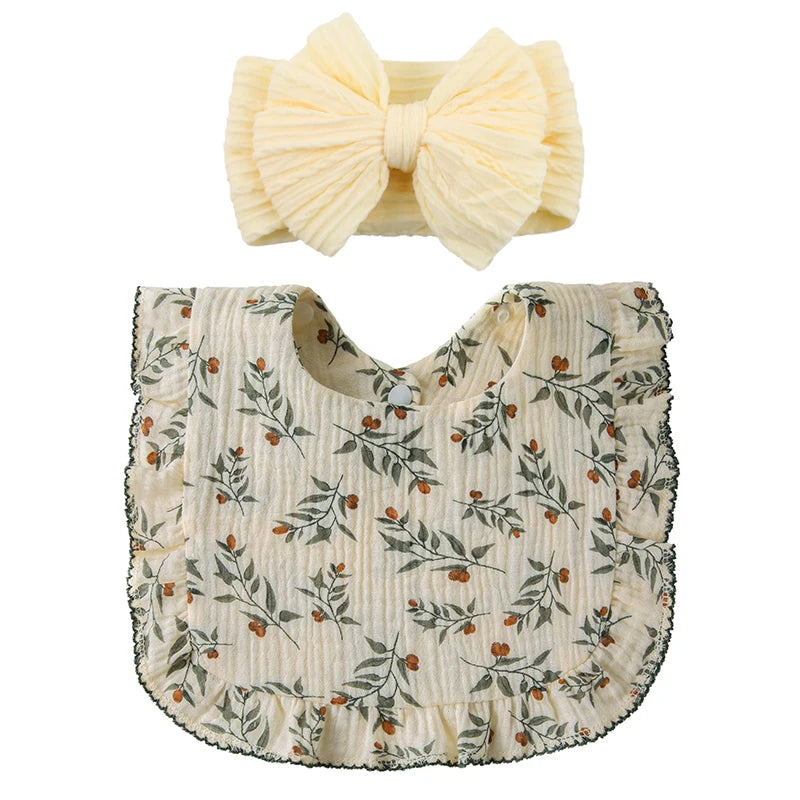 Floral Bib in cream with a matching yellow topknot bow baby gift set 