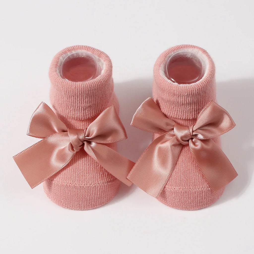 Dusty pink baby socks with satin bow
